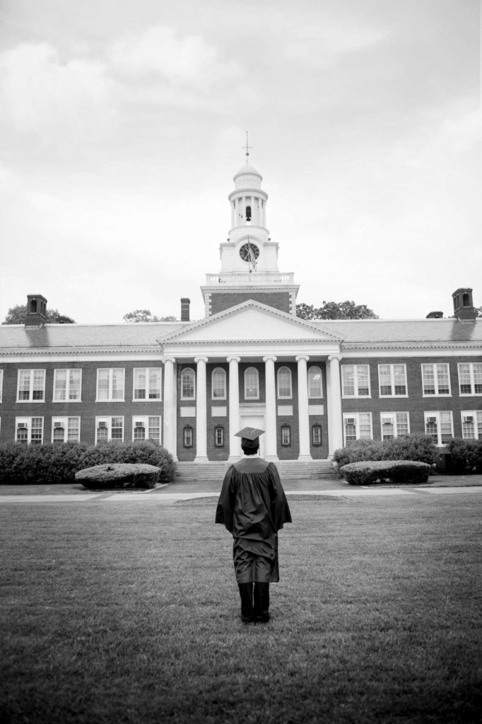 College Graduate Looking At College Building